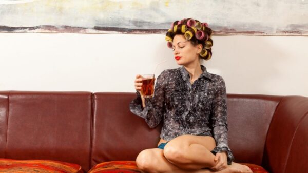 sexy girl drinking a drink on the couch picture id534217769