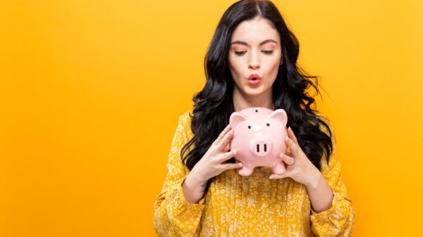 young woman with a piggy bank picture id857674990