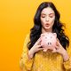 young woman with a piggy bank picture id857674990